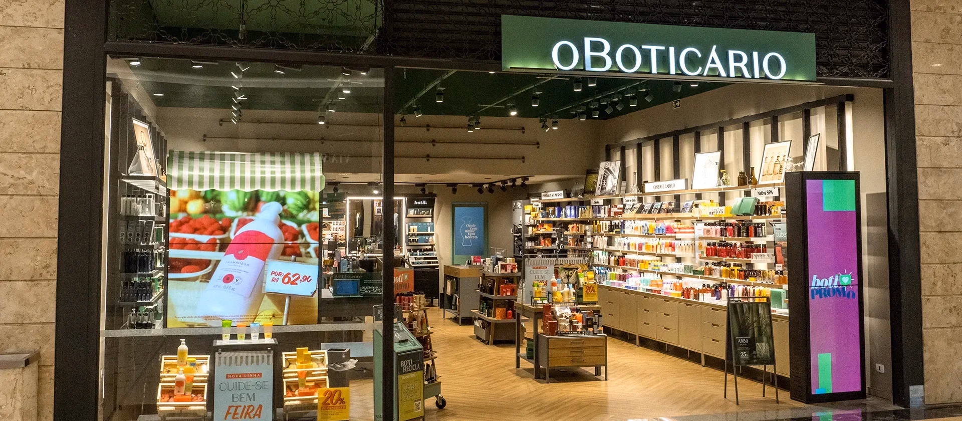 O Boticário store interior and entrance with green branding, wood fixtures, and product displays